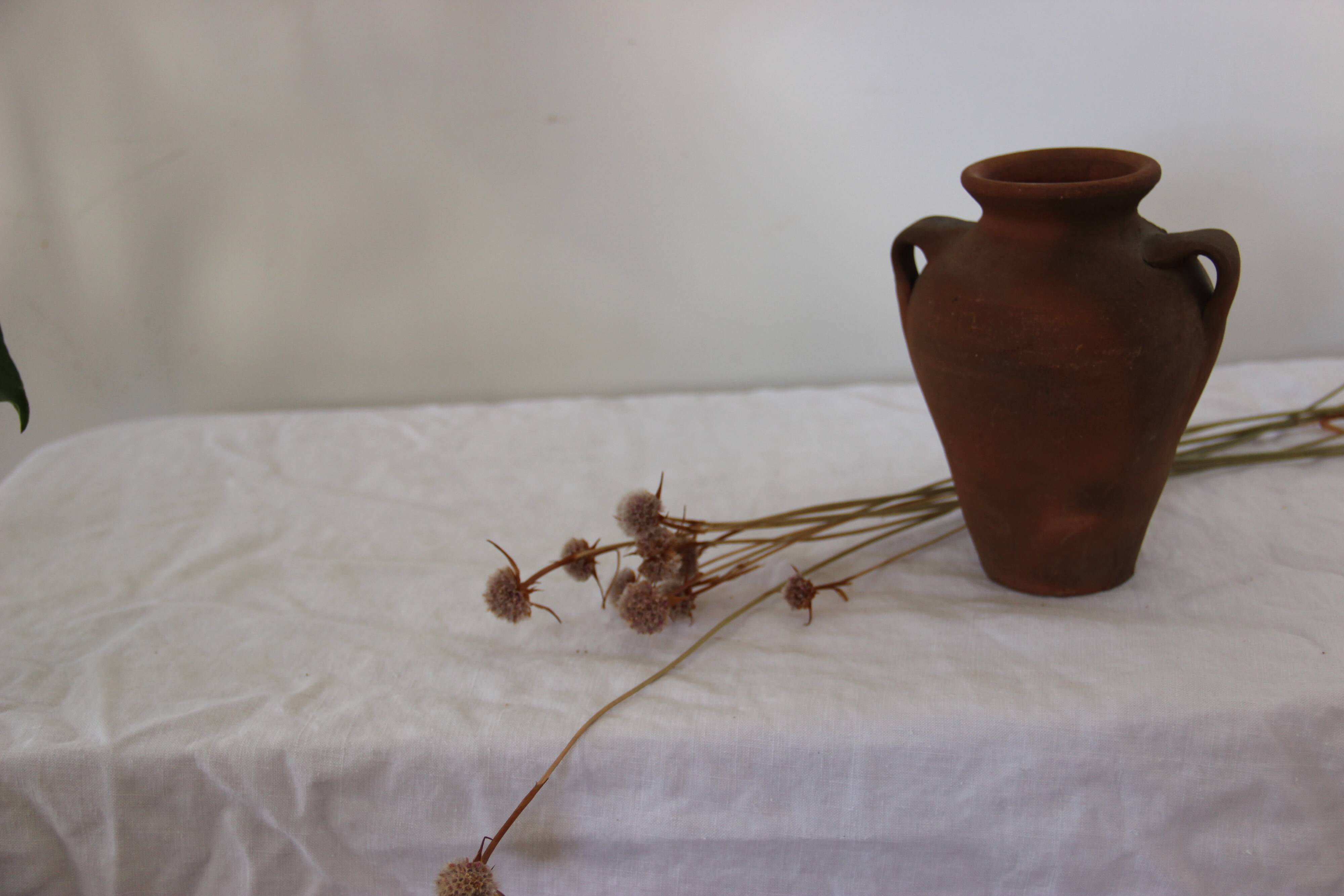 Old little terracotta jar