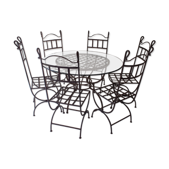 Round table metal structure and glass top its six chairs