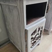 Two solid wood bedside tables with calfskin decoration.