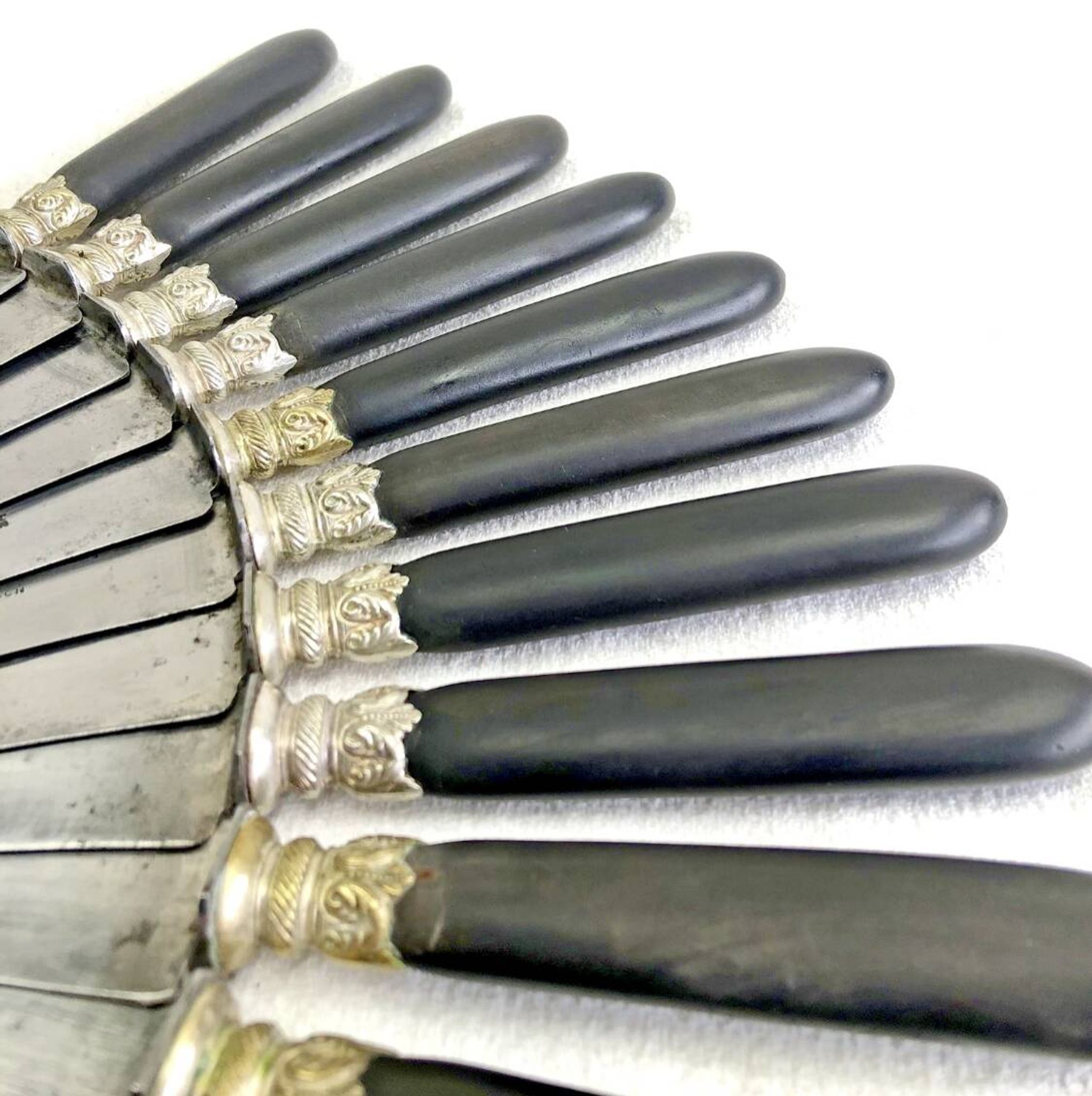 12 antique large table knives with ebony handles from the Napoleonic III period.