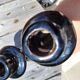 Iridescent black ceramic candle holder