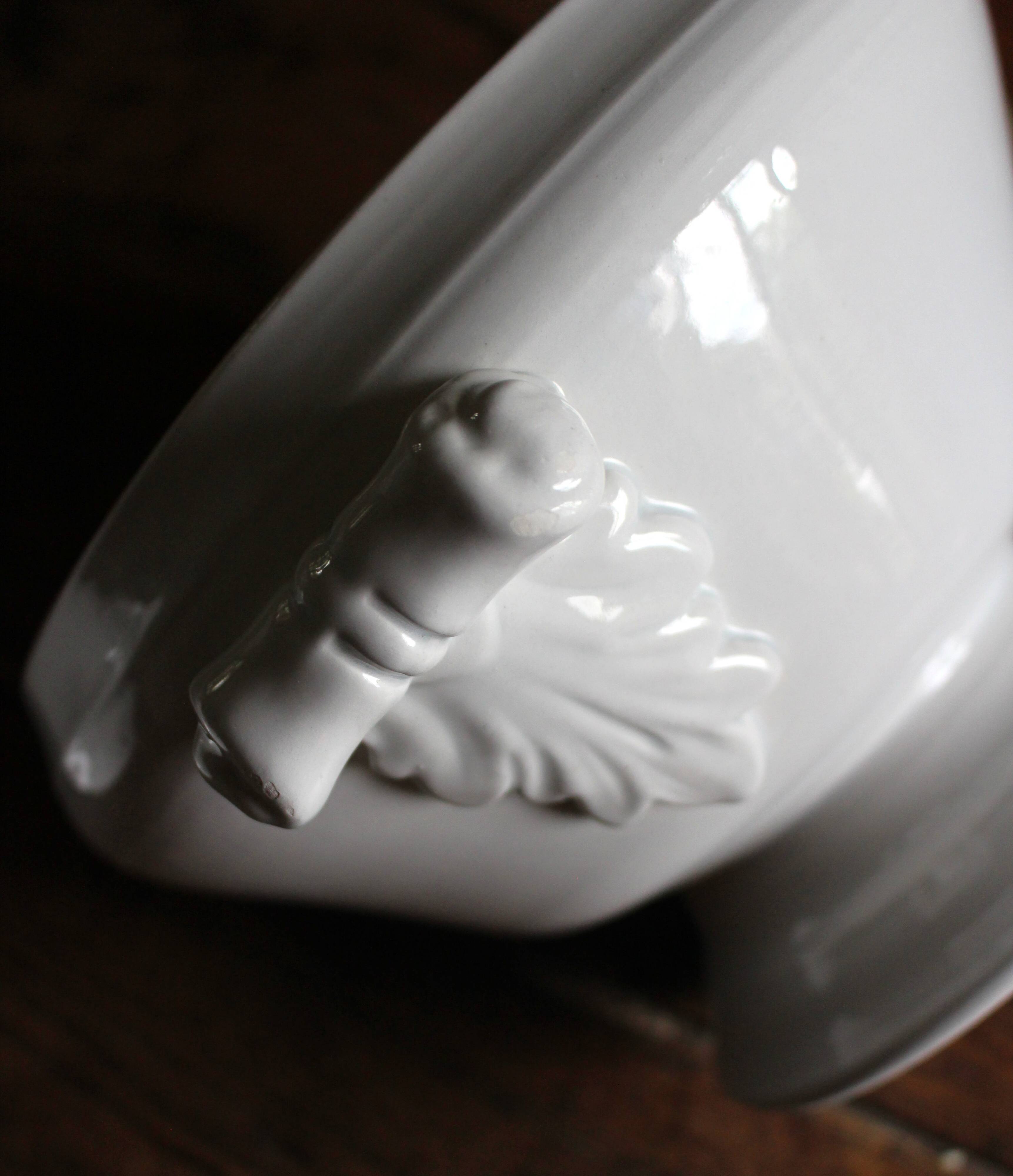 Antique soup tureen, white earthenware, with stopper decoration.
