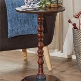 Round wooden tables with carving