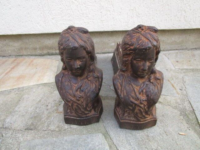 Pair of antique women's head cast iron chenets