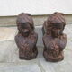 Pair of antique women's head cast iron chenets