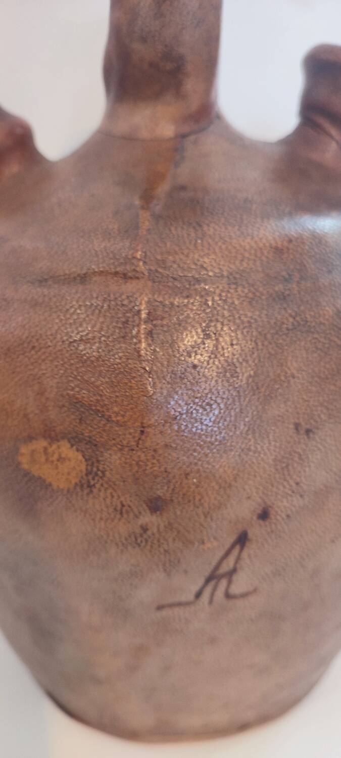 Gargoulette, terracotta jug covered with leather