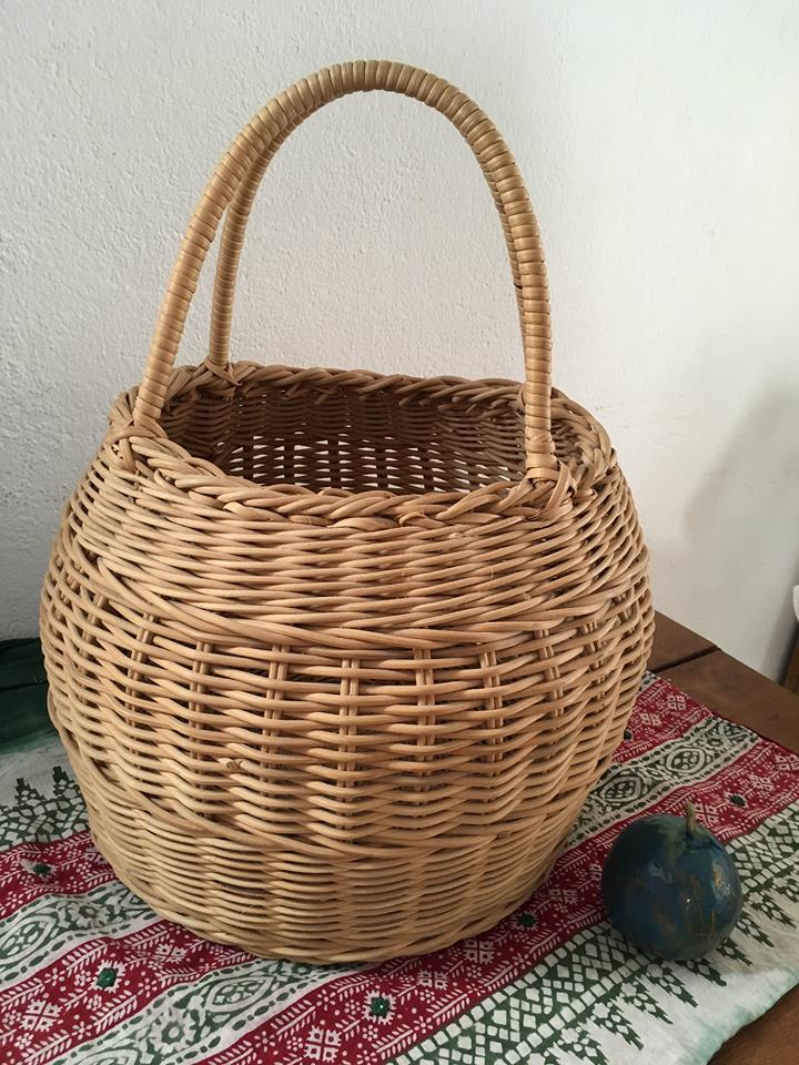 Round basket Wicker braided with two handles.