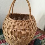 Round basket Wicker braided with two handles.