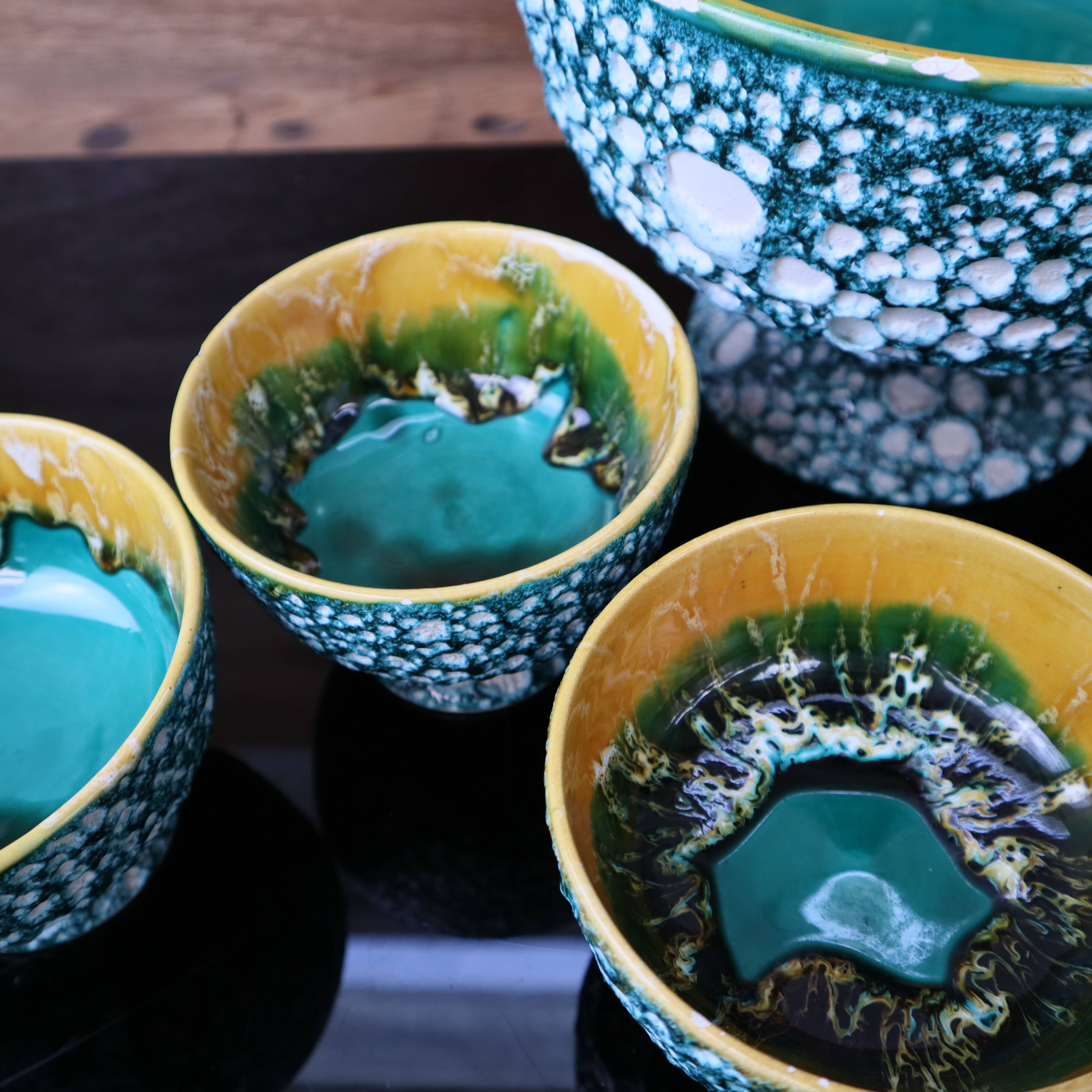 Salad bowl and its 6 Lava Green bowls in Vallauris style.