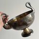 Large champagne bucket with patinated metal swan handles.