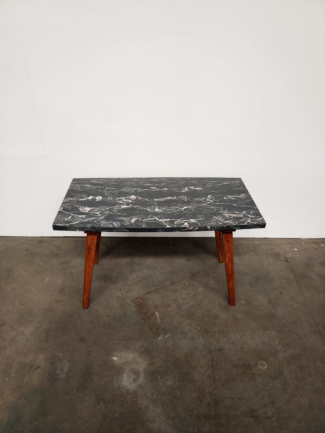 Marble effect Formica coffee table - flared legs