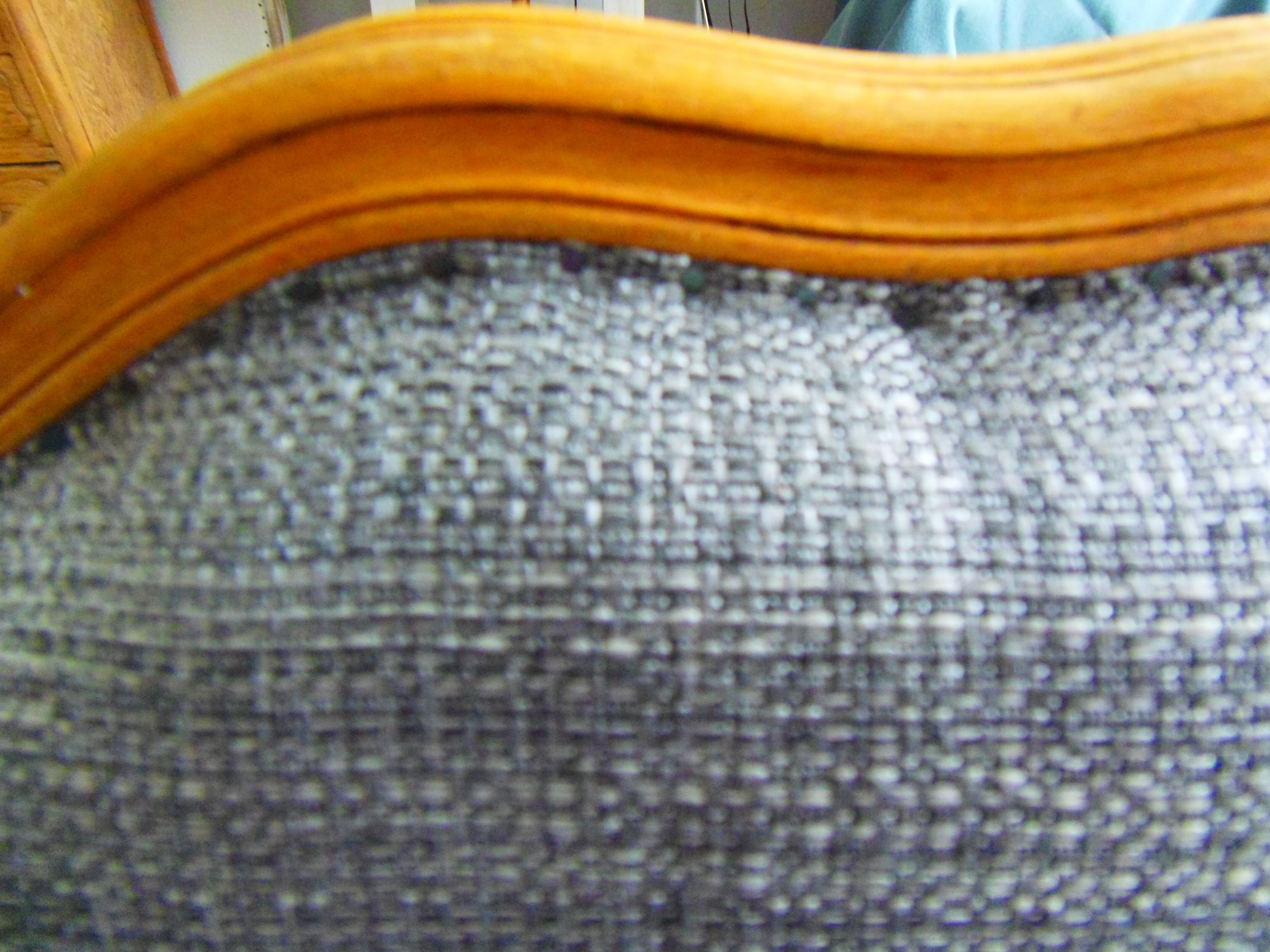 Louis XV style chair trim lined with a mottled grey wool, medium oak waxed finish