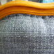 Louis XV style chair trim lined with a mottled grey wool, medium oak waxed finish