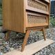 Vintage rattan chest of drawers with splayed legs from the 1950s.