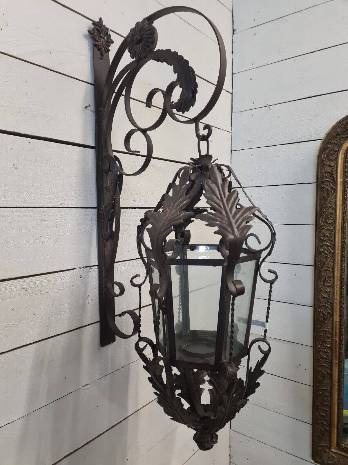 Patinated iron wall lantern