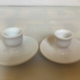 Pair of small white cellar rat candlesticks