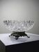 Pressed glass coupe with diamond points, antique from 1920-1950 on a pewter base.