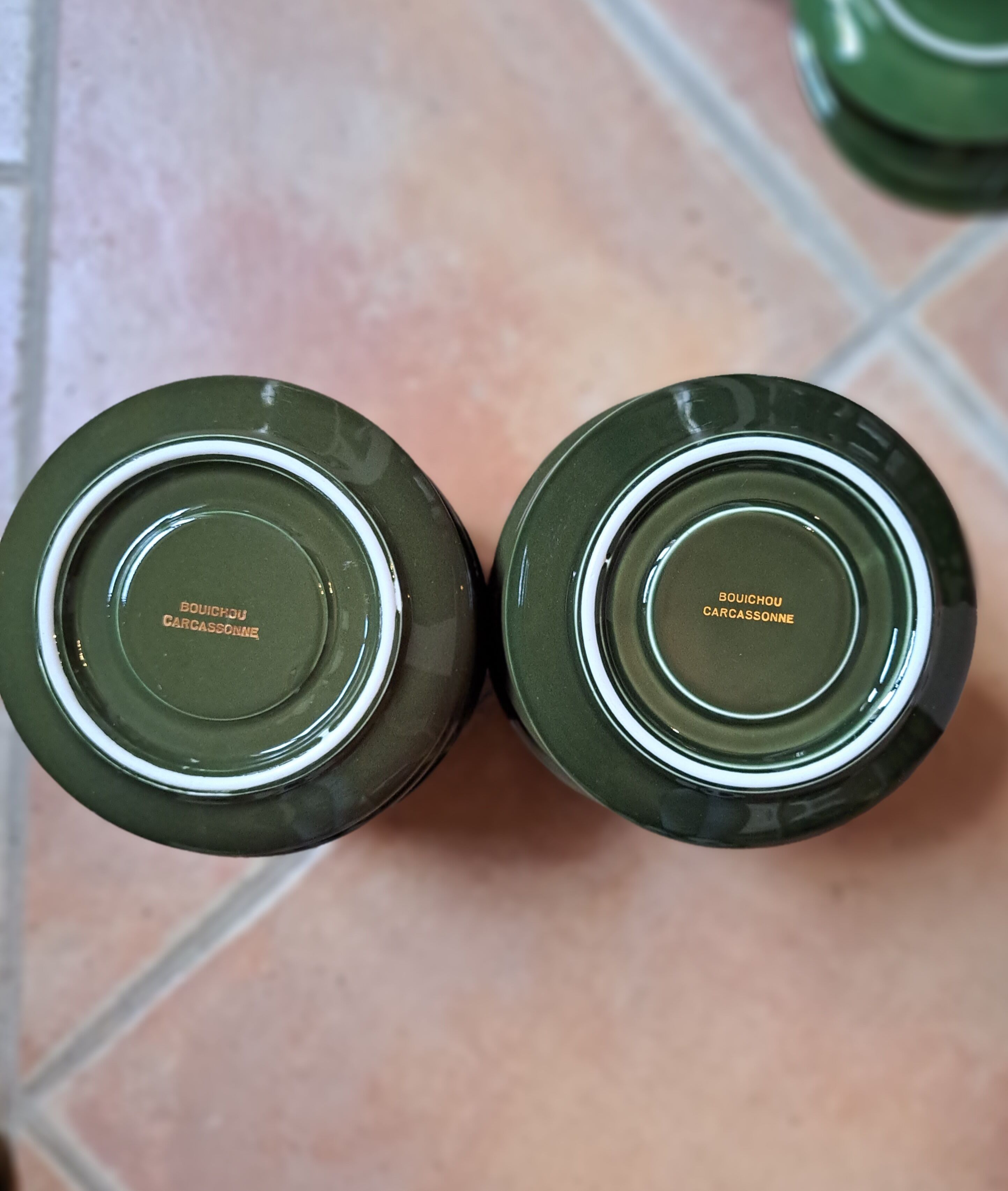 Green and gold coffee cups and sub-cups