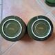 Green and gold coffee cups and sub-cups