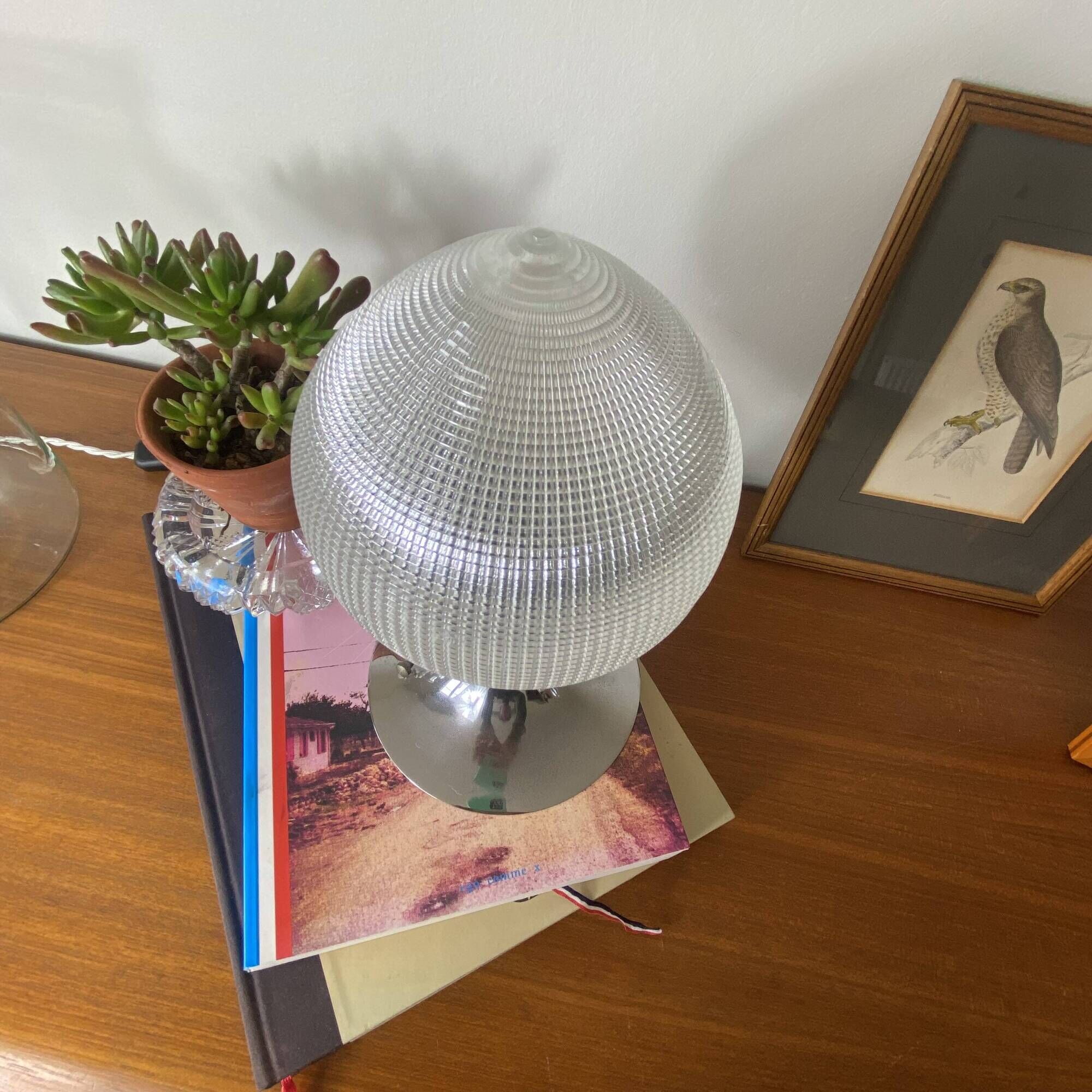 Antique lamp with a glass globe in Holophane style and chrome metal.