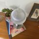 Antique lamp with a glass globe in Holophane style and chrome metal.