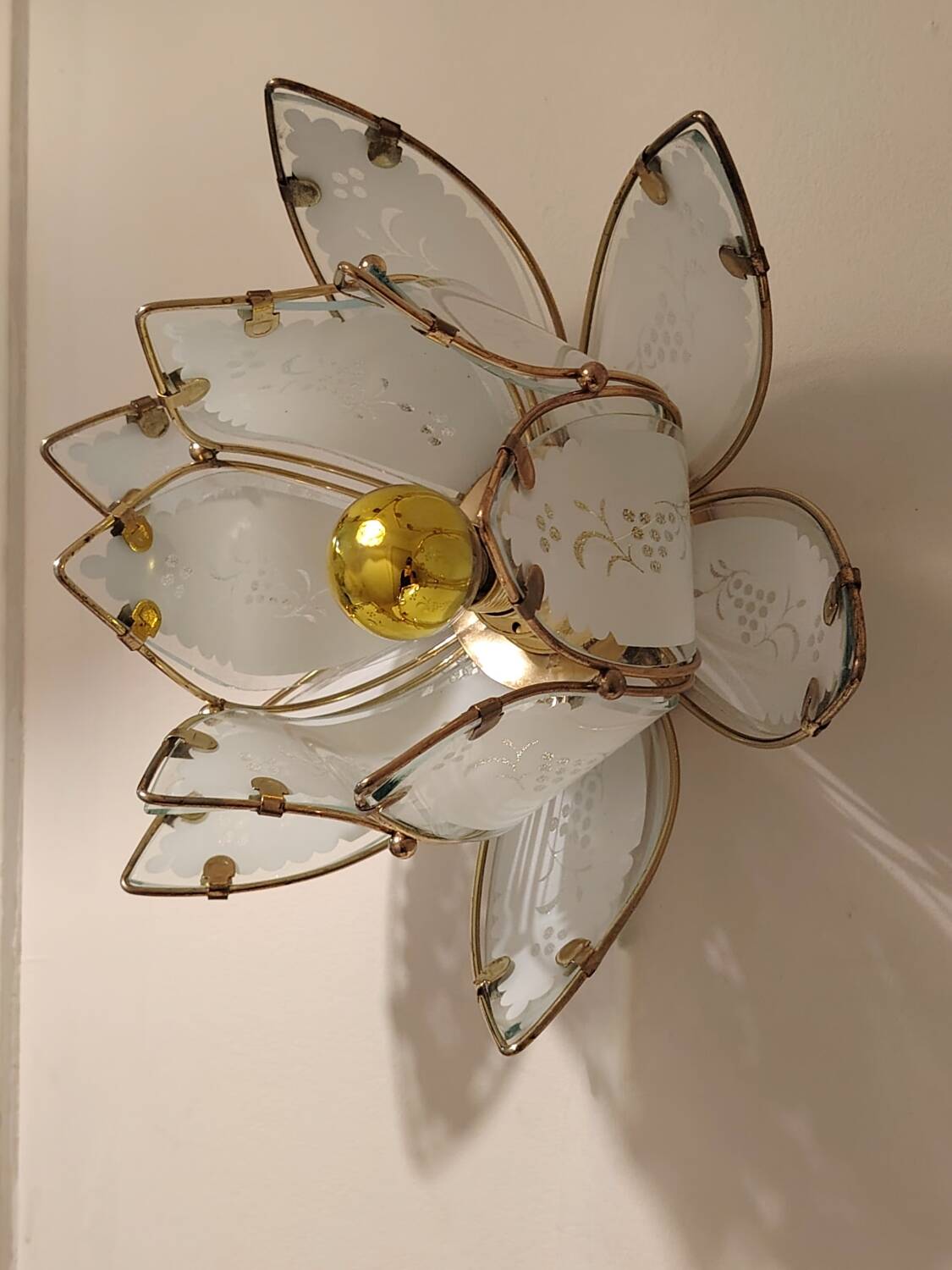 Lotus flower wall sconce in glass with a gold brass rim