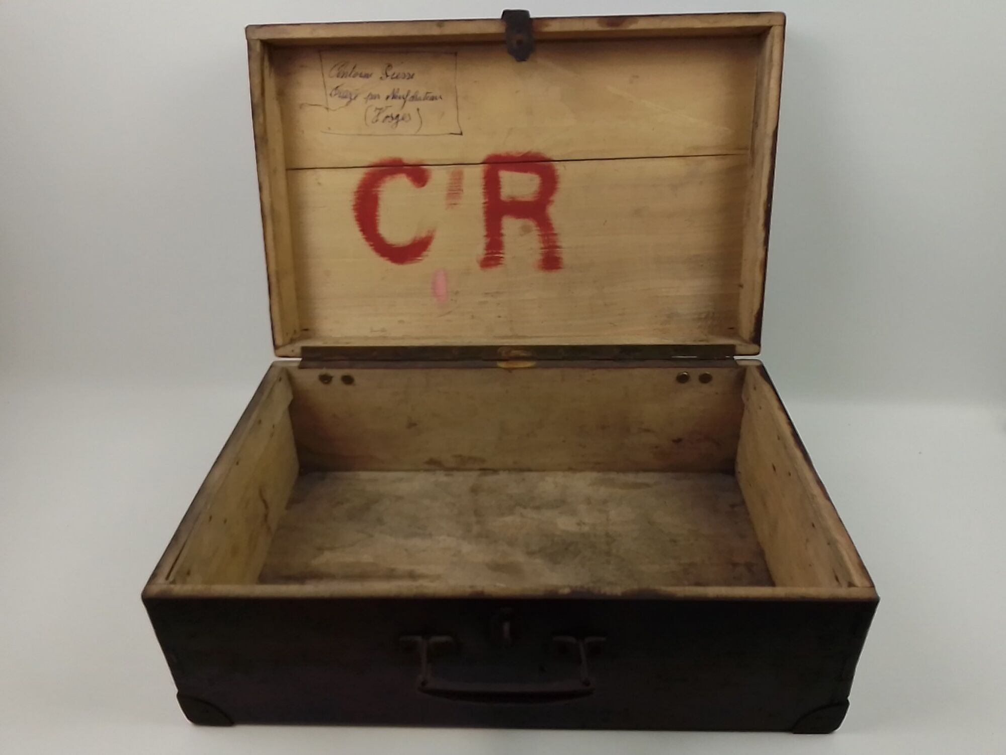 Old wooden suitcase with a padlock
