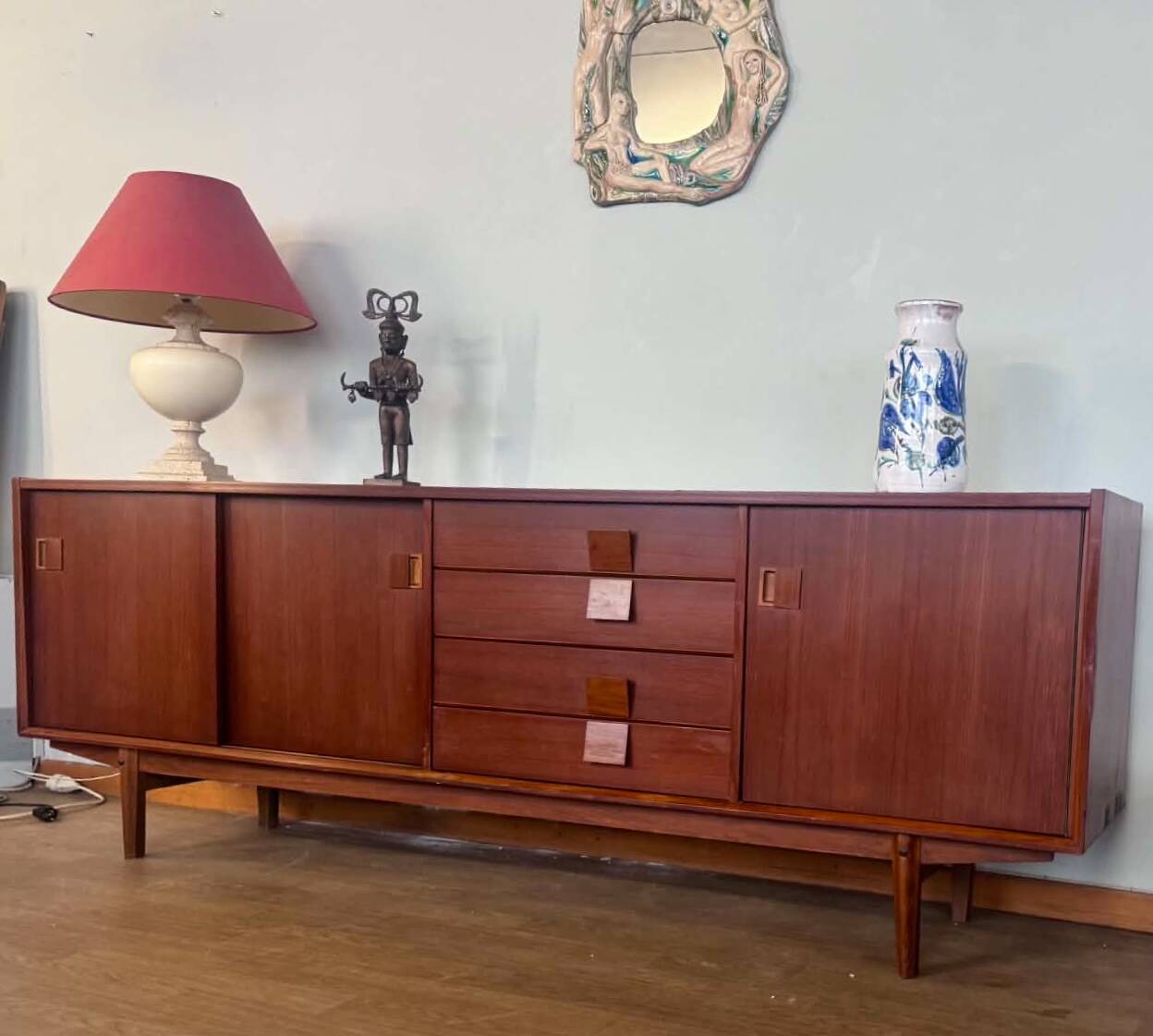 Scandinavian teak sideboard, 230 cm long, with 3 doors and 4 drawers.
