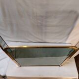 Vintage fireplace screen in smoked glass and gold-tone metal