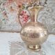 Chiseled brass pitcher decorated foliage