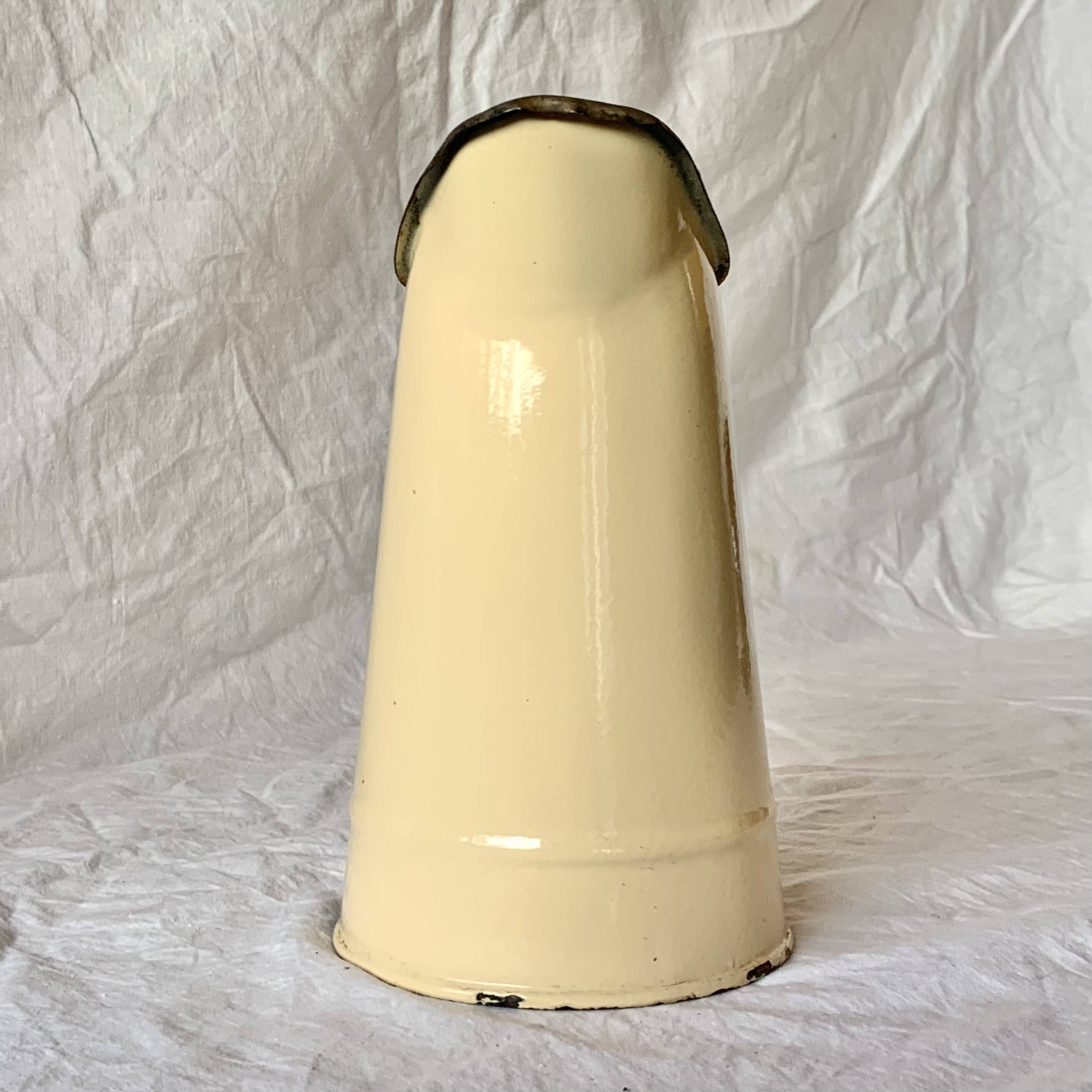 Vintage pitcher or jug in beige enamelled sheet metal