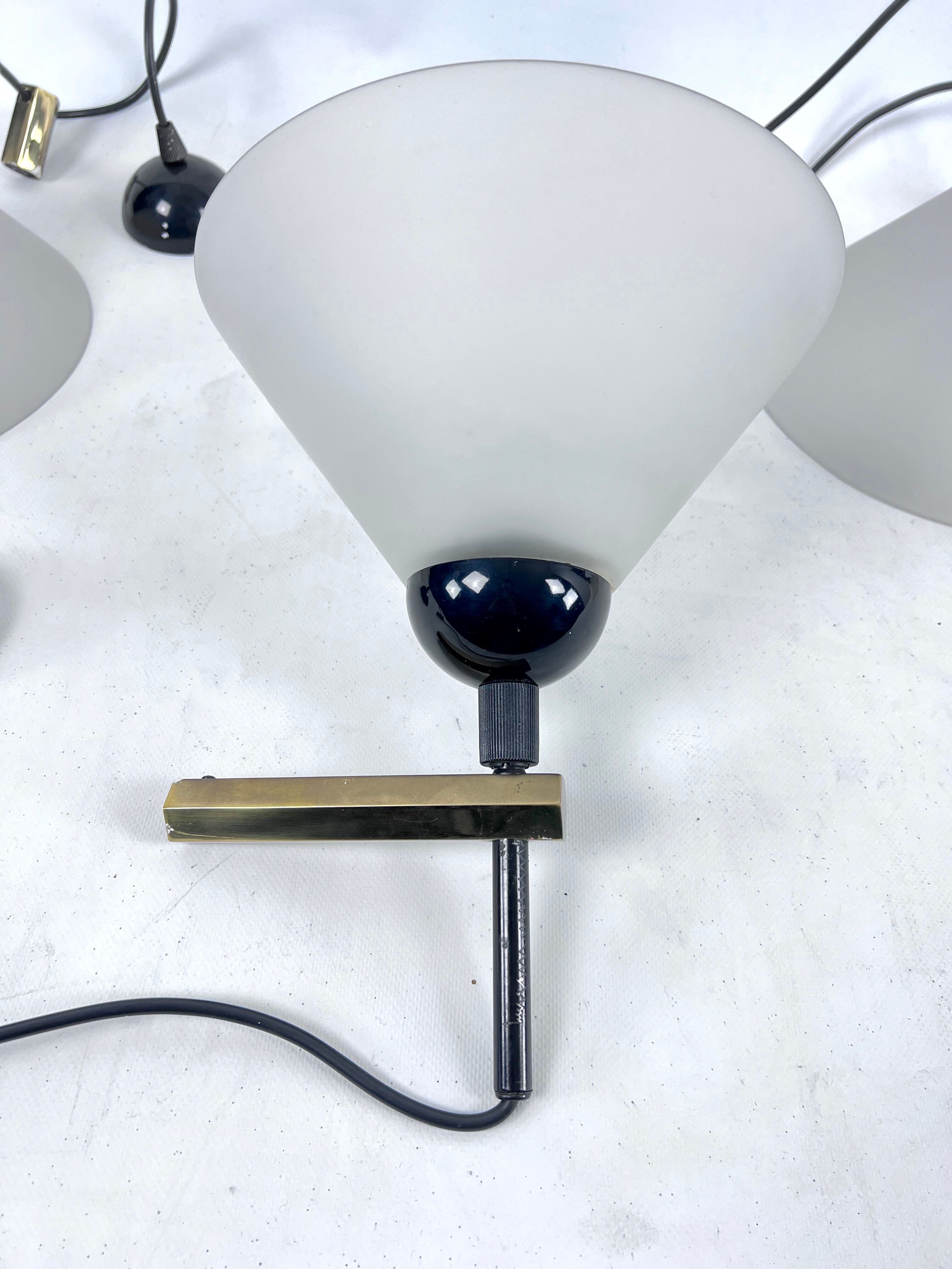 Rare Set of four Italian Modern brass and Murano glass wall lamps by Quattrifolio. 1970s