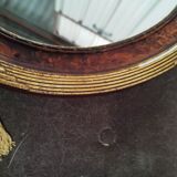 Golden oval art deco mirror