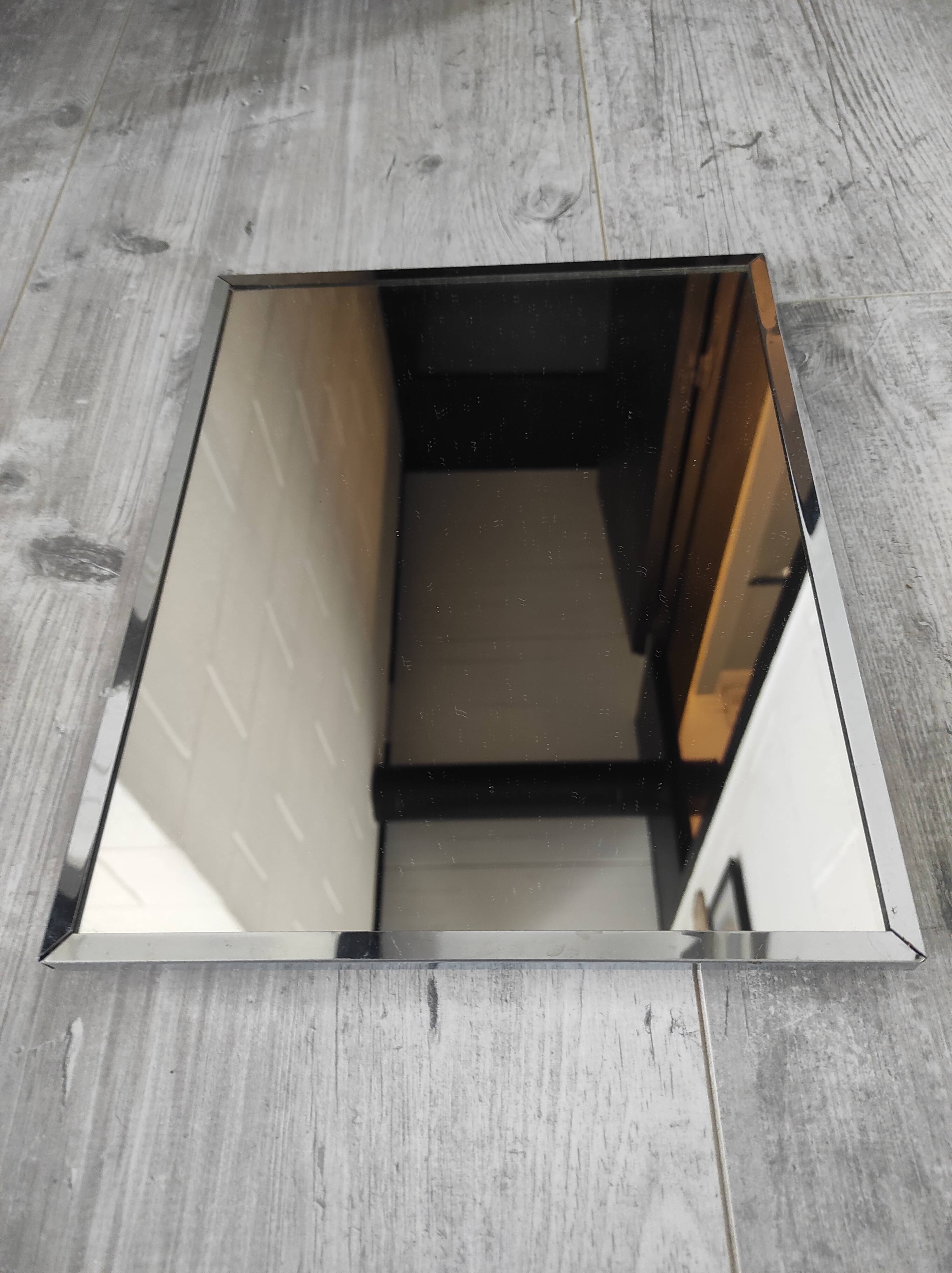 Vintage mirror with silver metal frame to hang