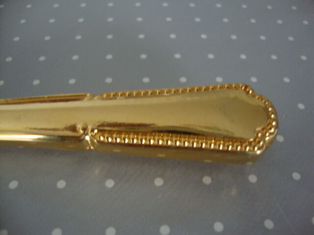 Golden metal pie shovel