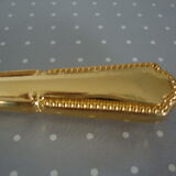 Golden metal pie shovel