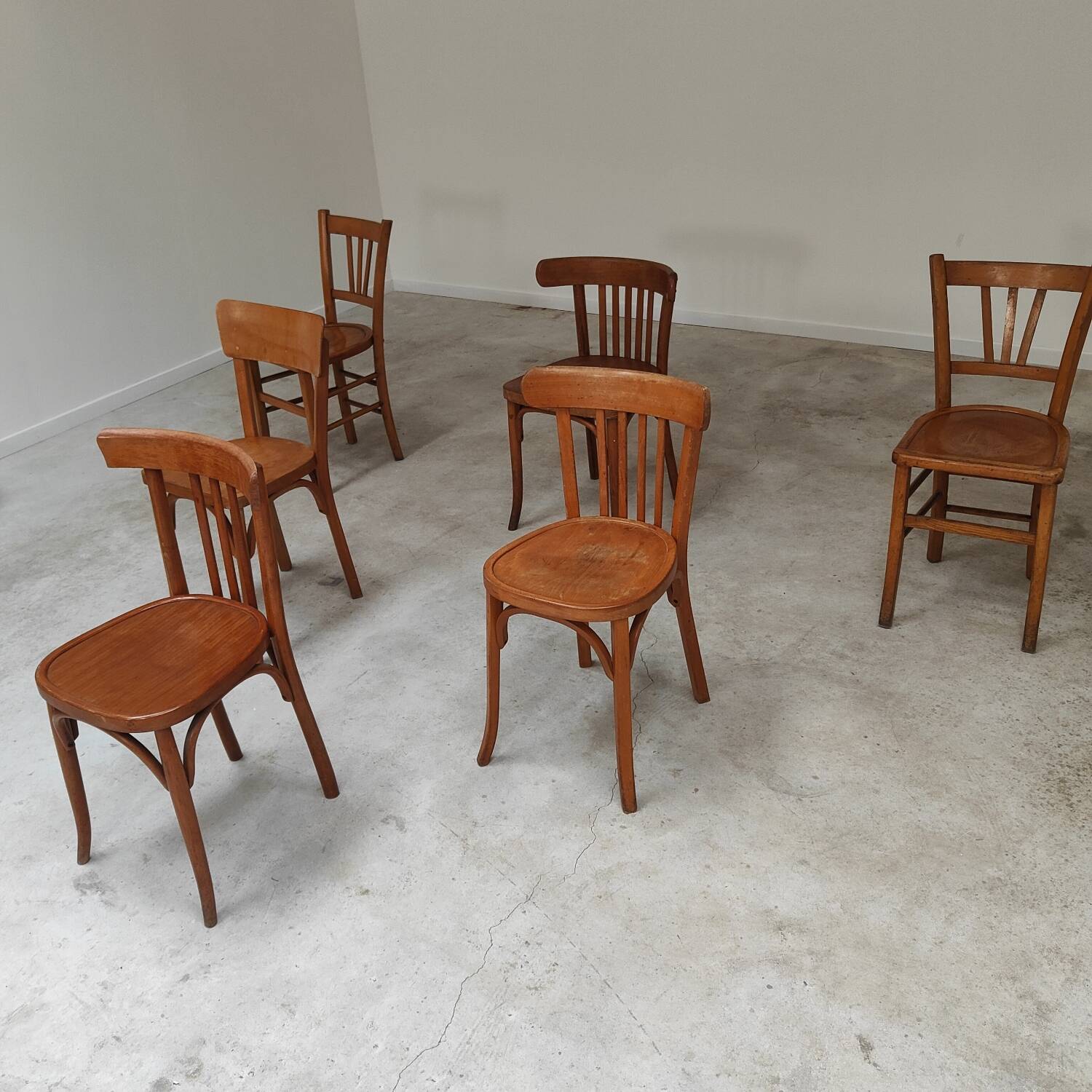 Set of 6 mismatched blond wood bistro chairs