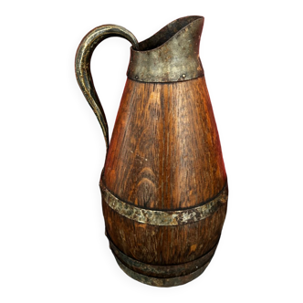 Wine pitcher made of wood and encircled metal
