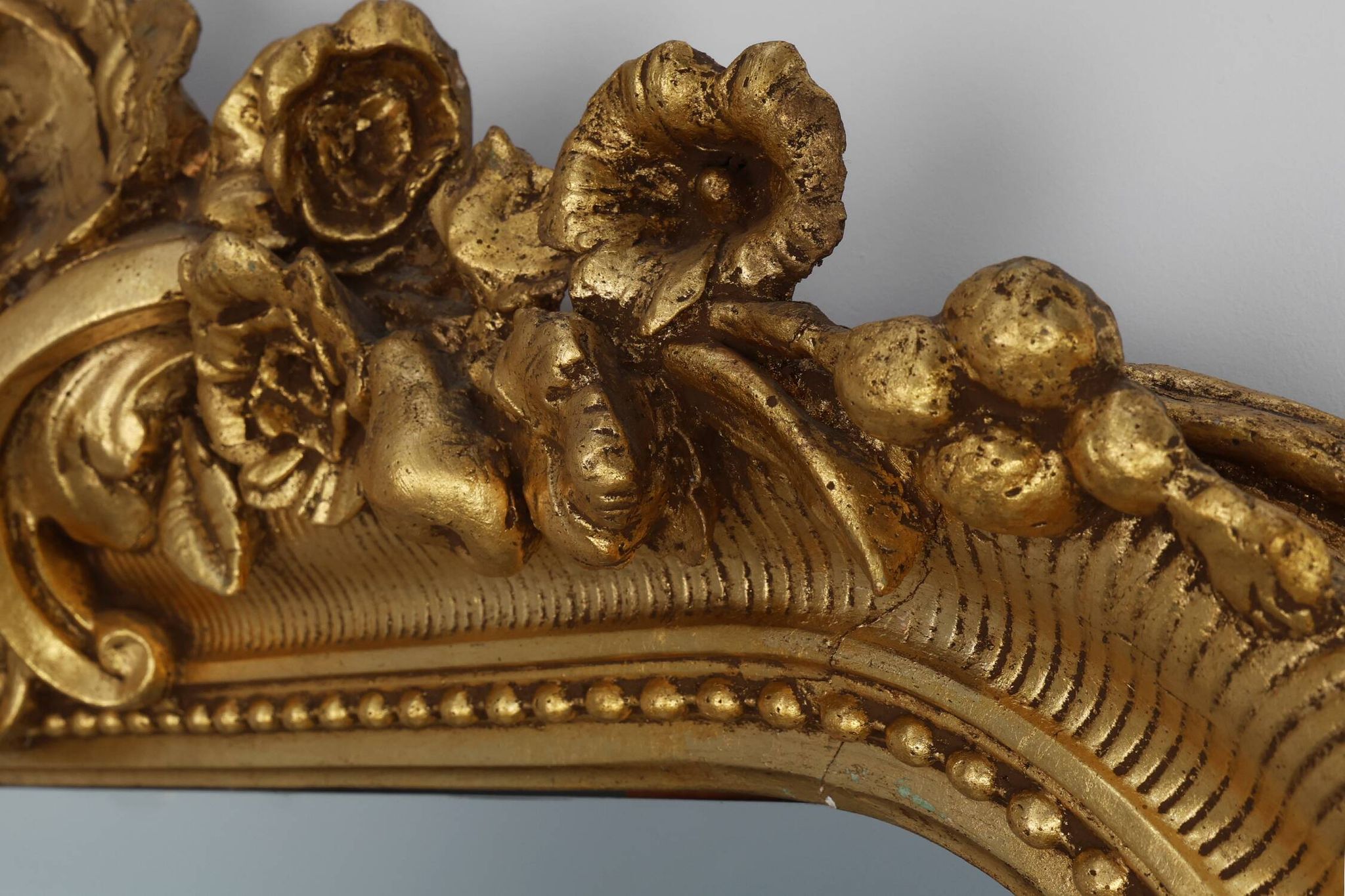 Baroque mantel mirror in carved wood and gilded plaster, France circa 1850.