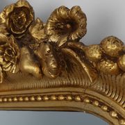 Baroque mantel mirror in carved wood and gilded plaster, France circa 1850.