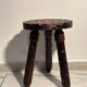 Brutalist sculpted tripod stool in solid wood — 1960s