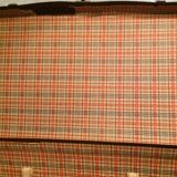 Suitcase vintage leather inside and brown carpeted home