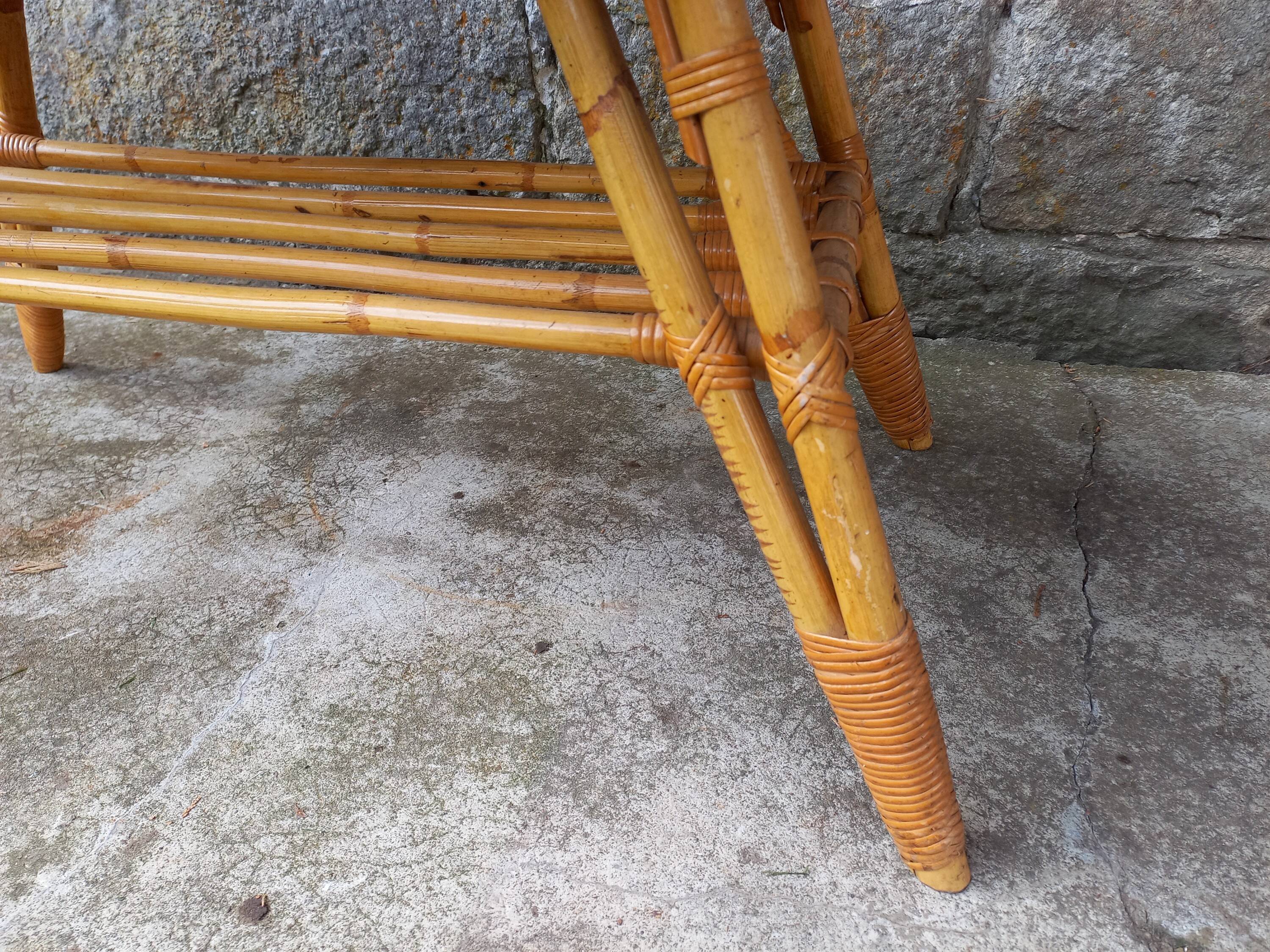 Rattan coffee table with compass legs