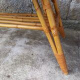 Rattan coffee table with compass legs