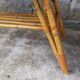 Rattan coffee table with compass legs