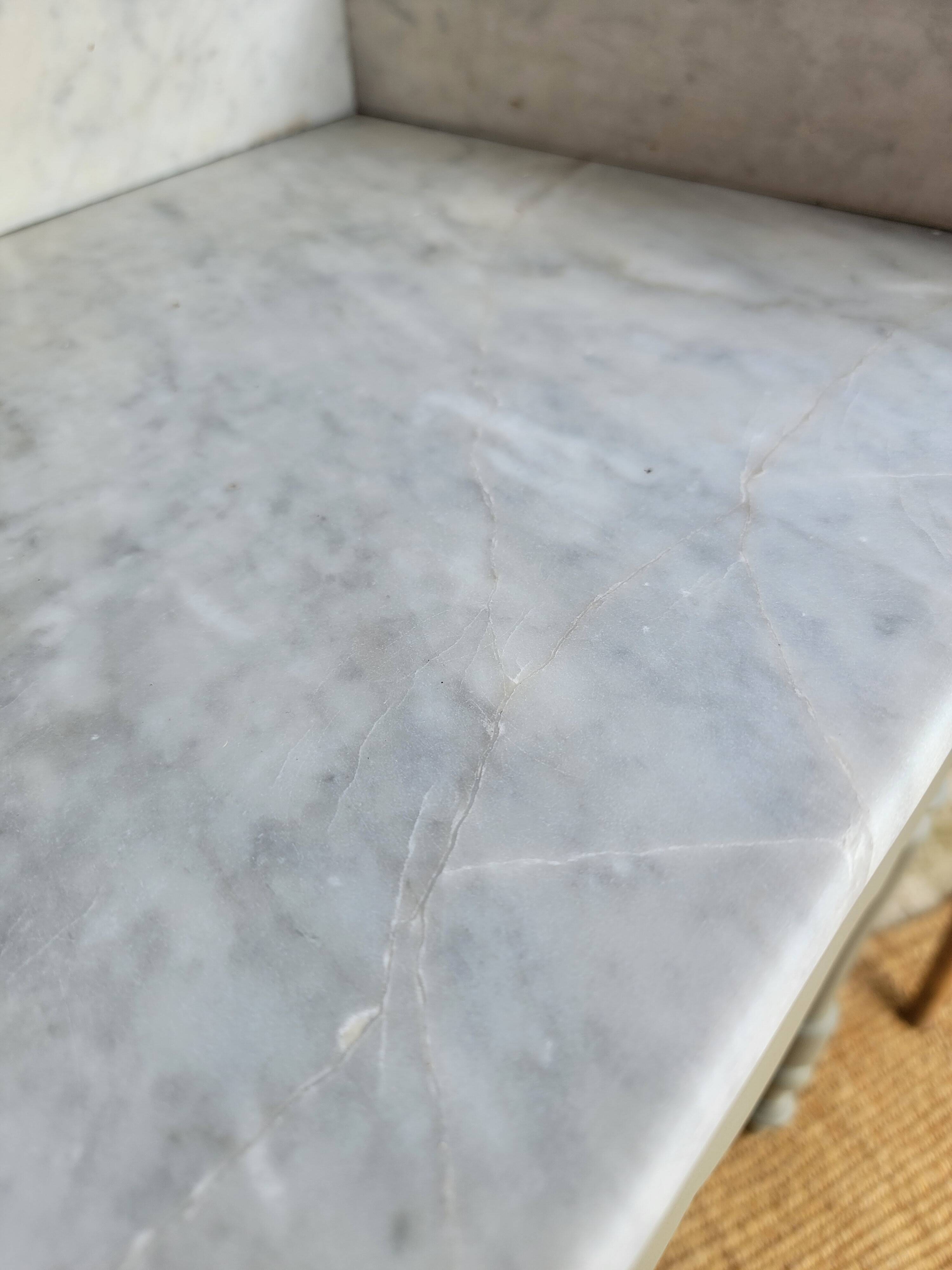 Antique wooden dressing table with marble top and mirror.