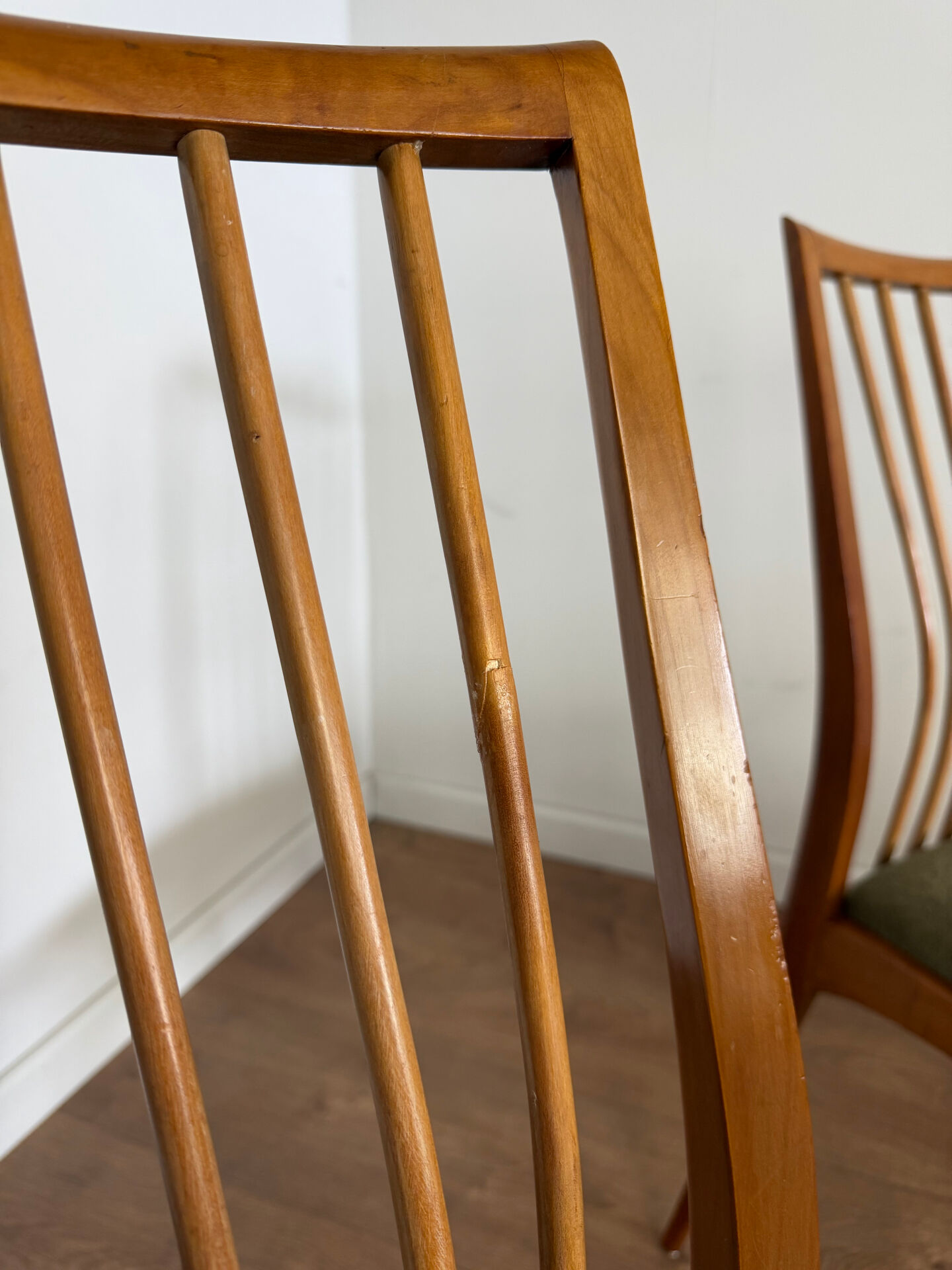 Scandinavian chairs with green velvet upholstery.