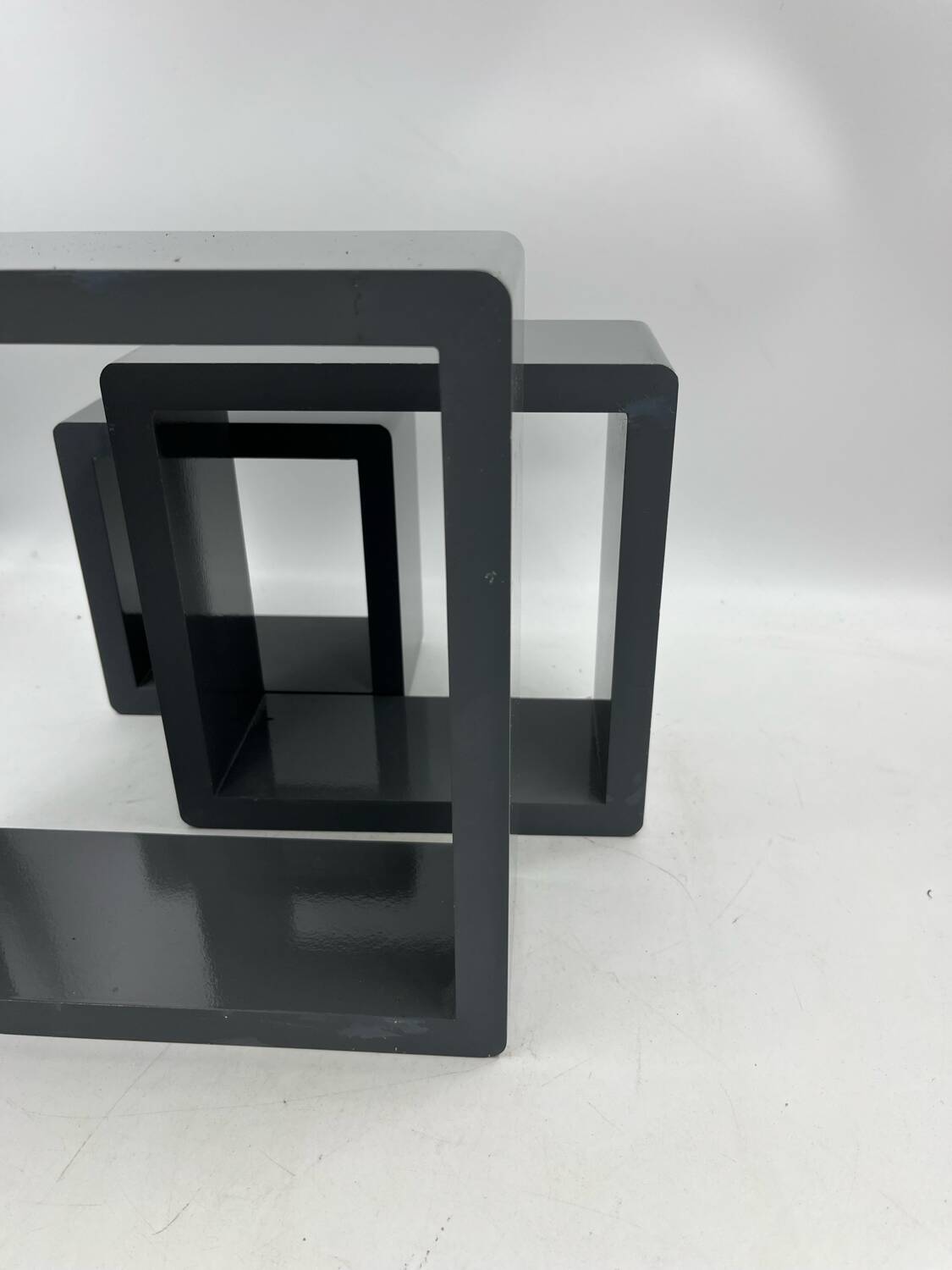 3 nesting shelves in grey lacquer.