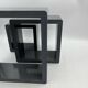 3 nesting shelves in grey lacquer.
