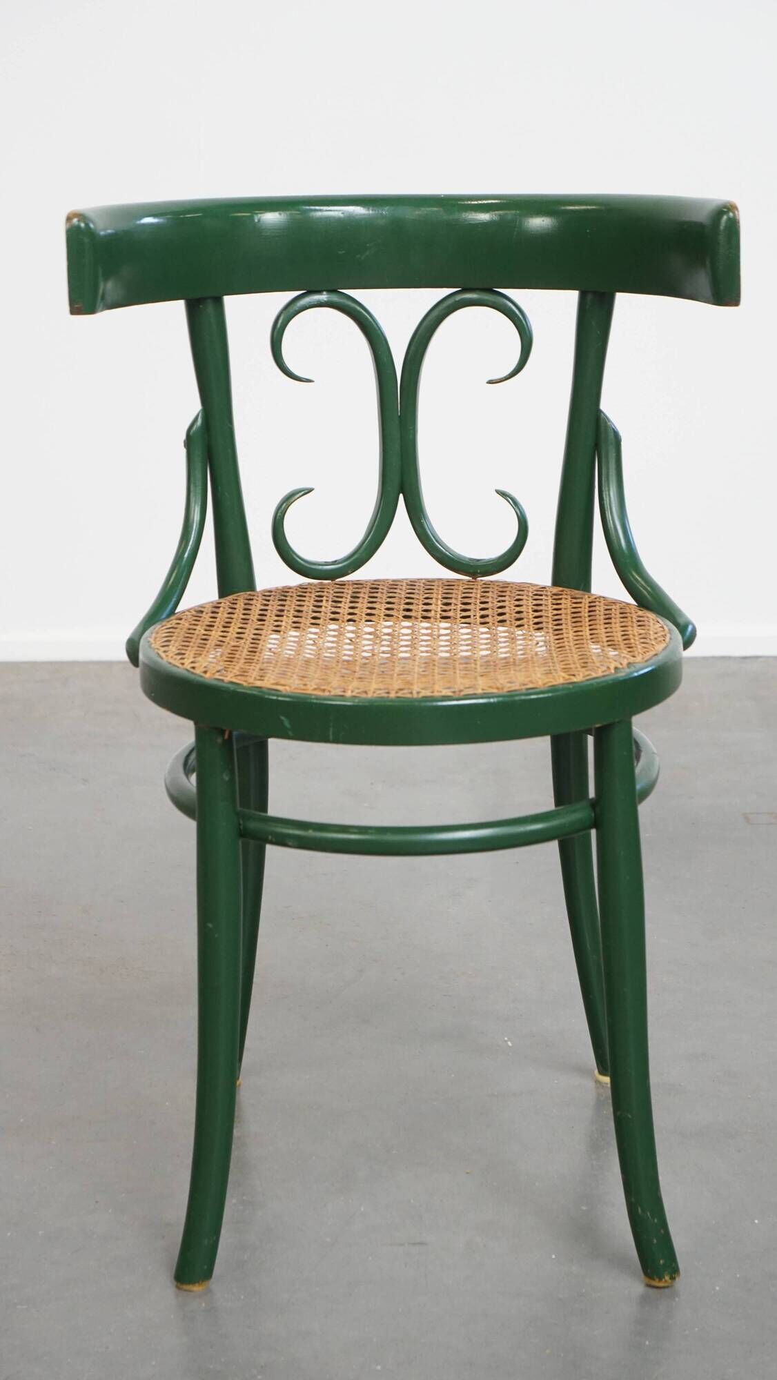 Vintage green bistro chair with woven reed seat